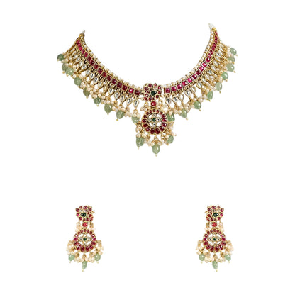 Traditional Kundan choker necklace set with ruby stones, green bead drops, gold finish, and matching earrings for bridal and wedding wear.