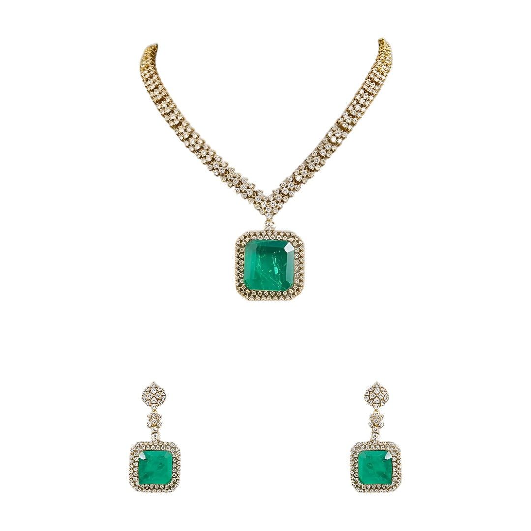 Elegant emerald green crystal pendant necklace set with sparkling zircon-studded chain and matching drop earrings in a gold-tone finish.