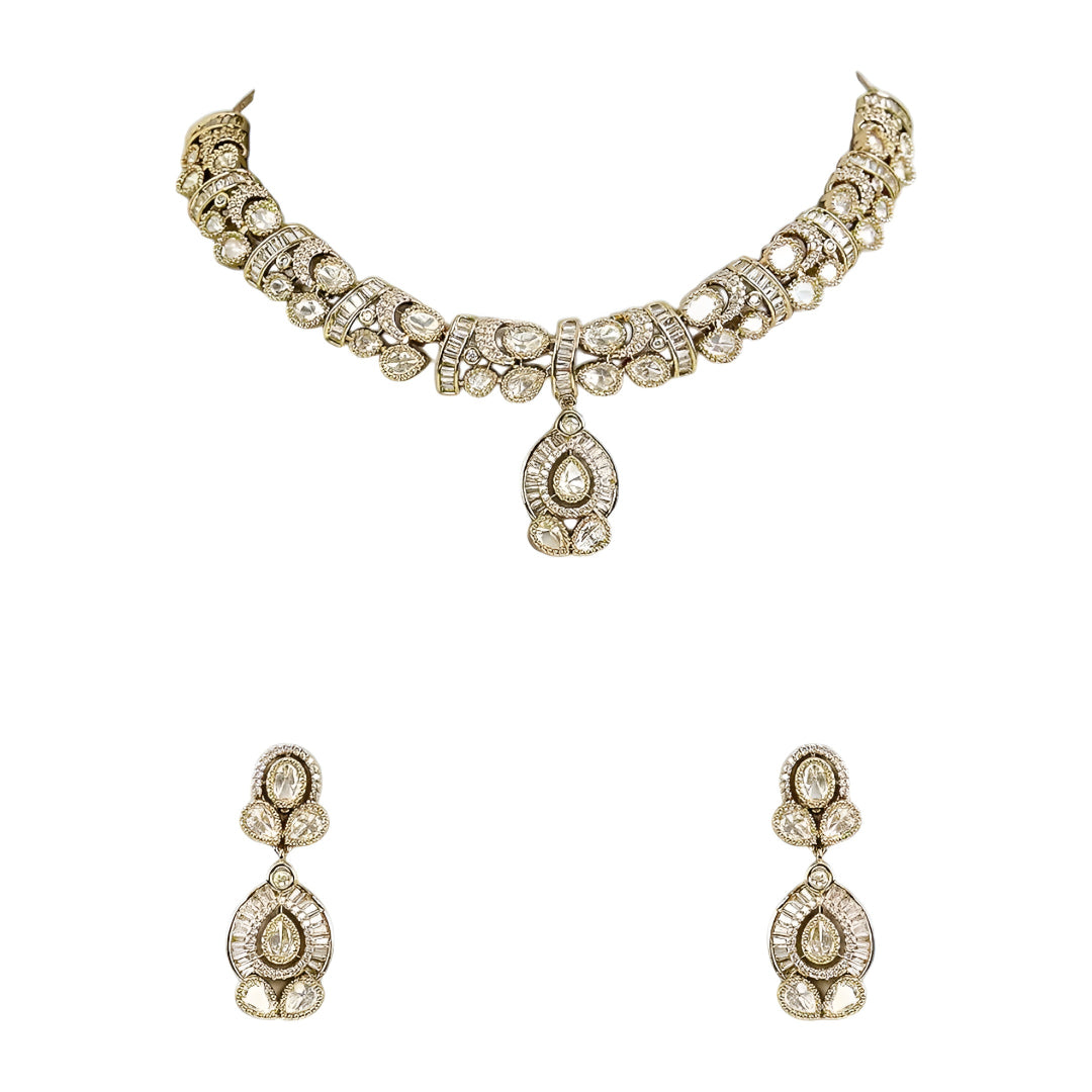 Gold-plated Kundan choker necklace set with matching drop earrings featuring teardrop stones and bridal-inspired traditional design.