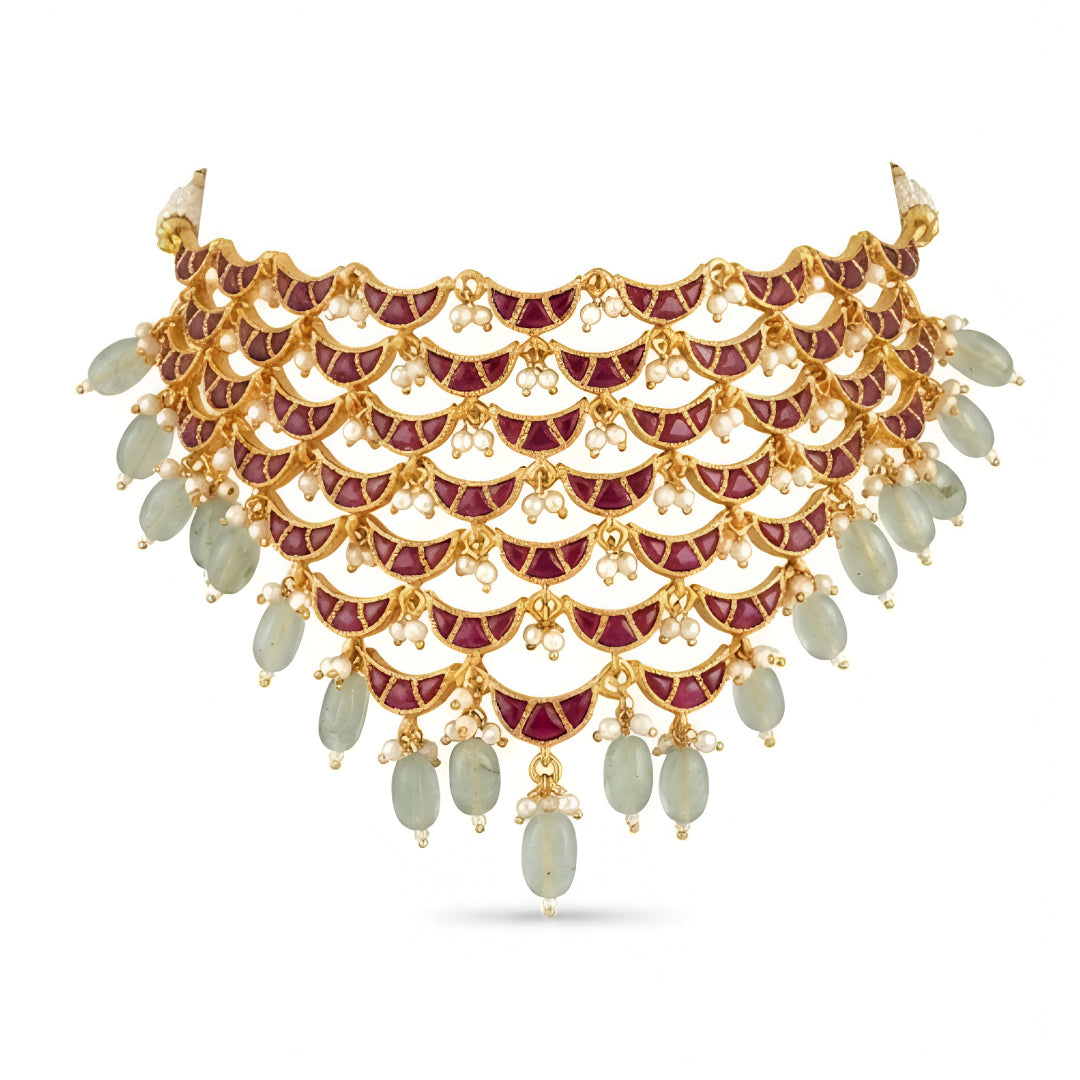 "Layered Kundan choker necklace and earring set in maroon gold with pearl and green bead drops, bridal jewellery styled on model"