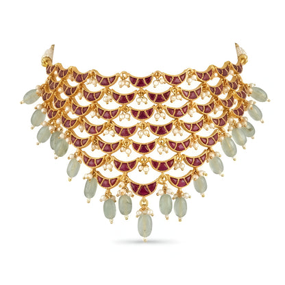 "Layered Kundan choker necklace and earring set in maroon gold with pearl and green bead drops, bridal jewellery styled on model"