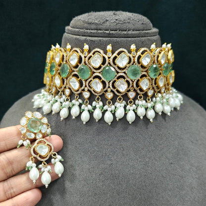 Mint green Kundan pearl choker necklace set with matching dangling earrings in gold plating by Auraa Trends