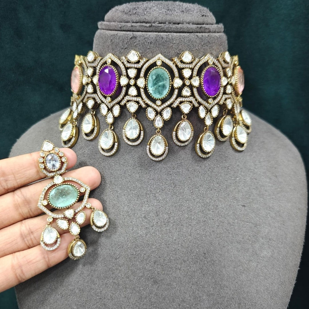Multicolor Kundan choker necklace set with matching chandelier earrings in gold plating by Auraa Trends