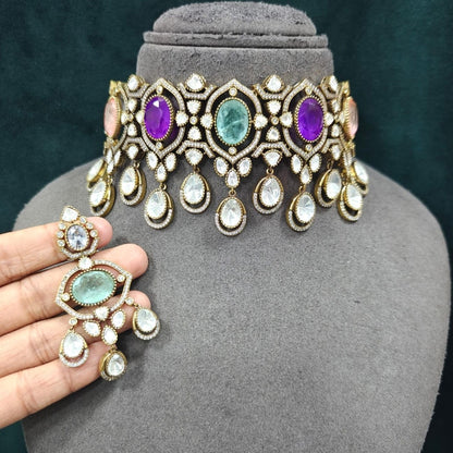 Multicolor Kundan choker necklace set with matching chandelier earrings in gold plating by Auraa Trends