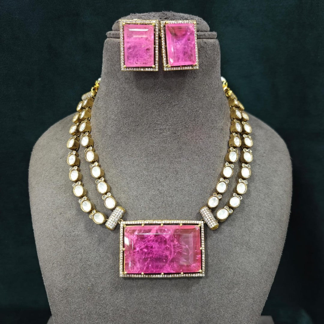 Pink crystal pendant necklace set with matching rectangular earrings in gold plating by Auraa Trends