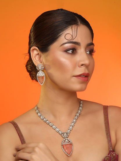 Gold-plated necklace set with peach teardrop pendant and matching statement earrings for bridal and festive wear