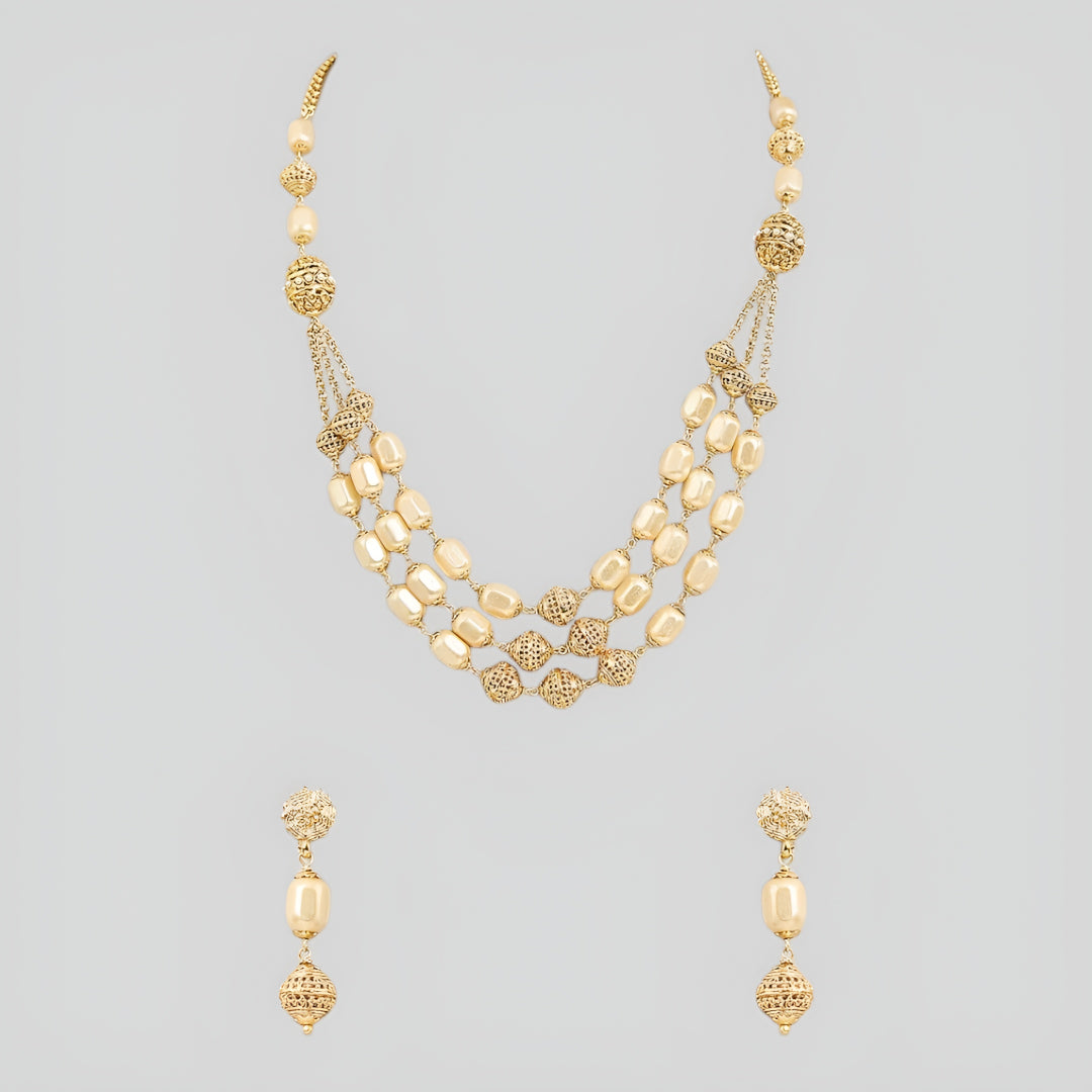 Elegant multi-layer ivory pearl beaded necklace set with gold-tone filigree accents and matching drop earrings for women.