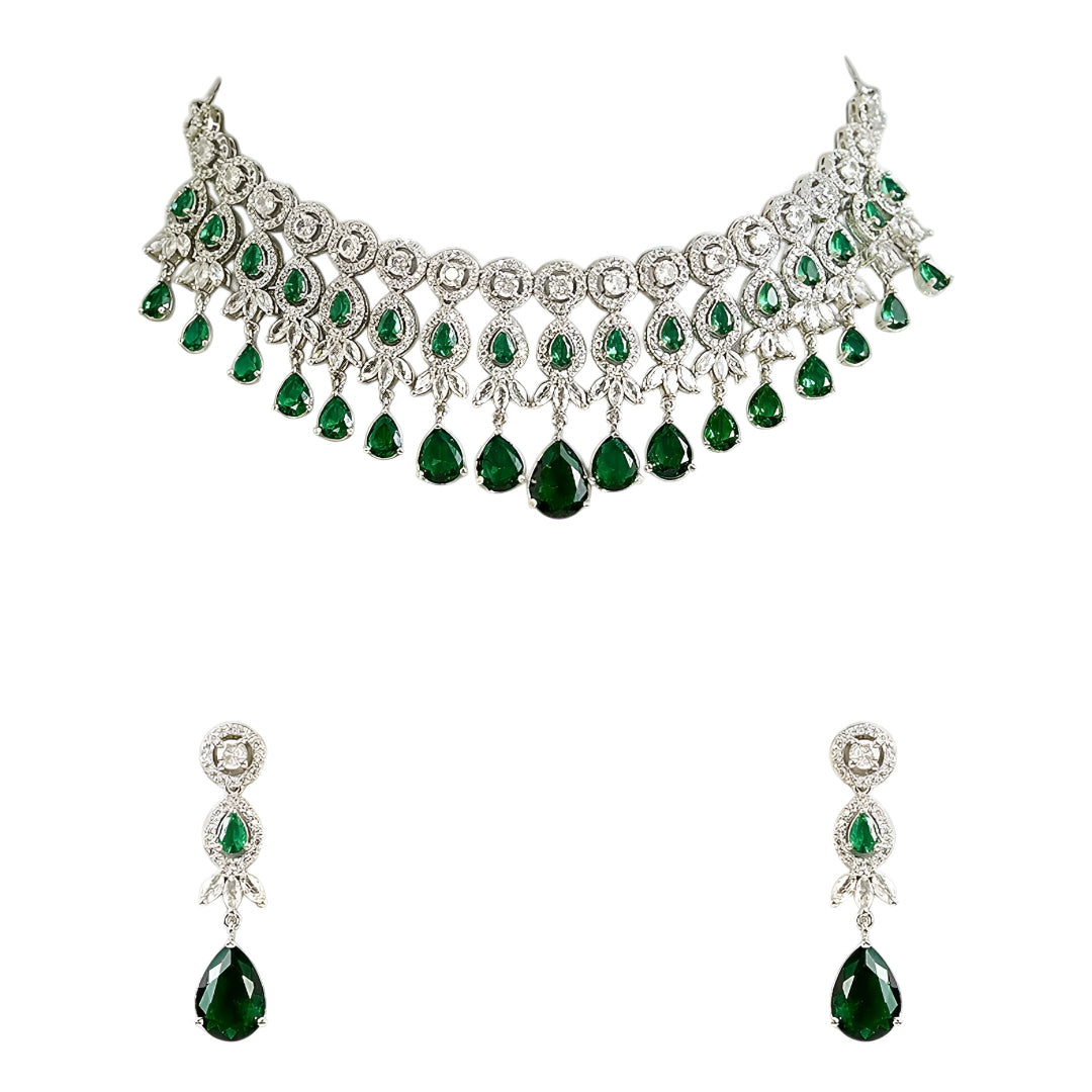Silver-tone choker necklace and earrings set featuring sparkling clear crystals and emerald green teardrop stones in an elegant bridal jewelry design.