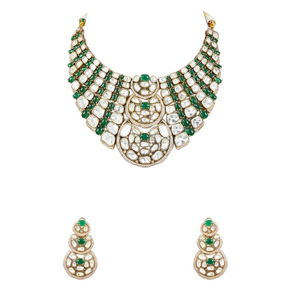 Luxury Kundan Polki necklace set with matching earrings featuring uncut Polki diamonds, green emerald accents, and traditional bridal jewelry craftsmanship in a gold finish.
