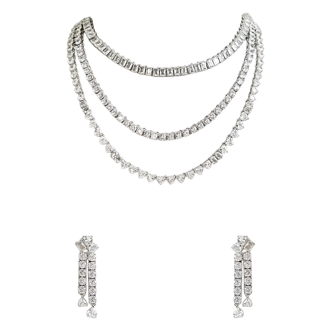 Silver-tone layered crystal necklace with matching drop earrings featuring sparkling clear stones in an elegant bridal jewelry design.