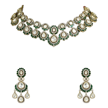 Green Kundan Polki bridal necklace set with matching earrings featuring white stones and emerald green accents in antique gold finish.