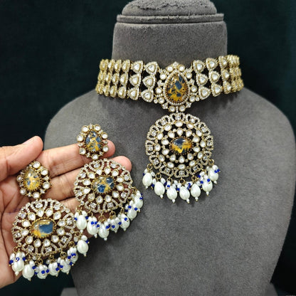 Royal blue stone Kundan choker necklace set with matching statement earrings featuring white Kundan stones, blue center stones, and pearl drop detailing.