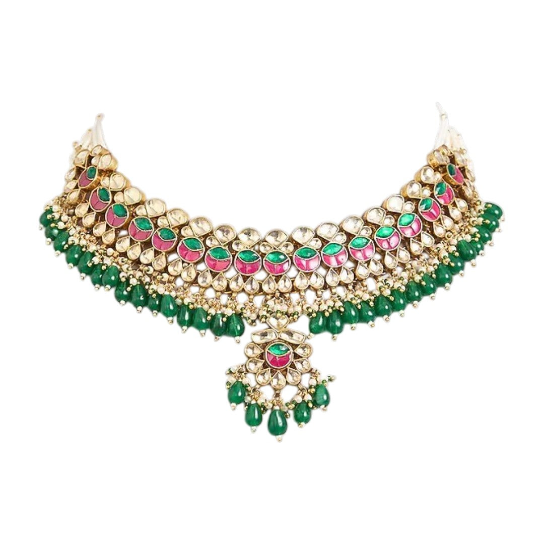 Traditional Kundan choker necklace set with pink stone detailing, green bead drops, and matching earrings in gold-plated finish for bridal wear.
