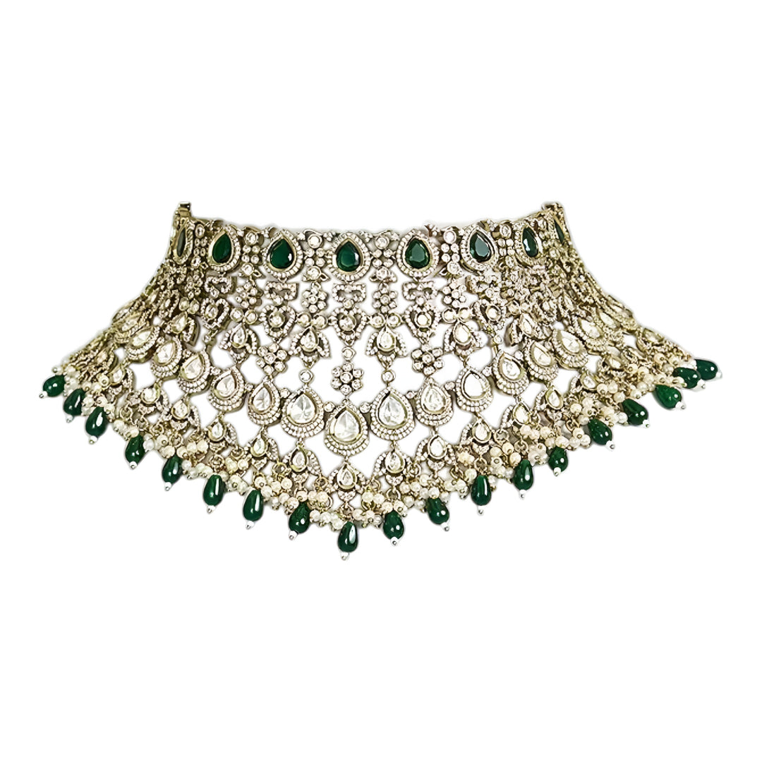 Green Kundan Polki bridal choker necklace set with intricate lattice design, pearl embellishments, green teardrop beads, and matching statement earrings.