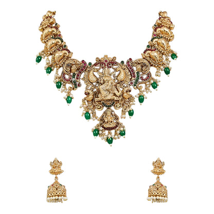 Traditional South Indian Temple Jewellery Lakshmi Necklace Set with matching Jhumka Earrings, antique gold finish, green bead drops, and ruby stone embellishments for bridal and festive wear.