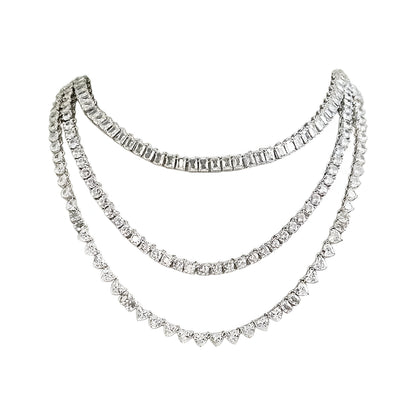 Silver-tone layered crystal necklace with matching drop earrings featuring sparkling clear stones in an elegant bridal jewelry design.