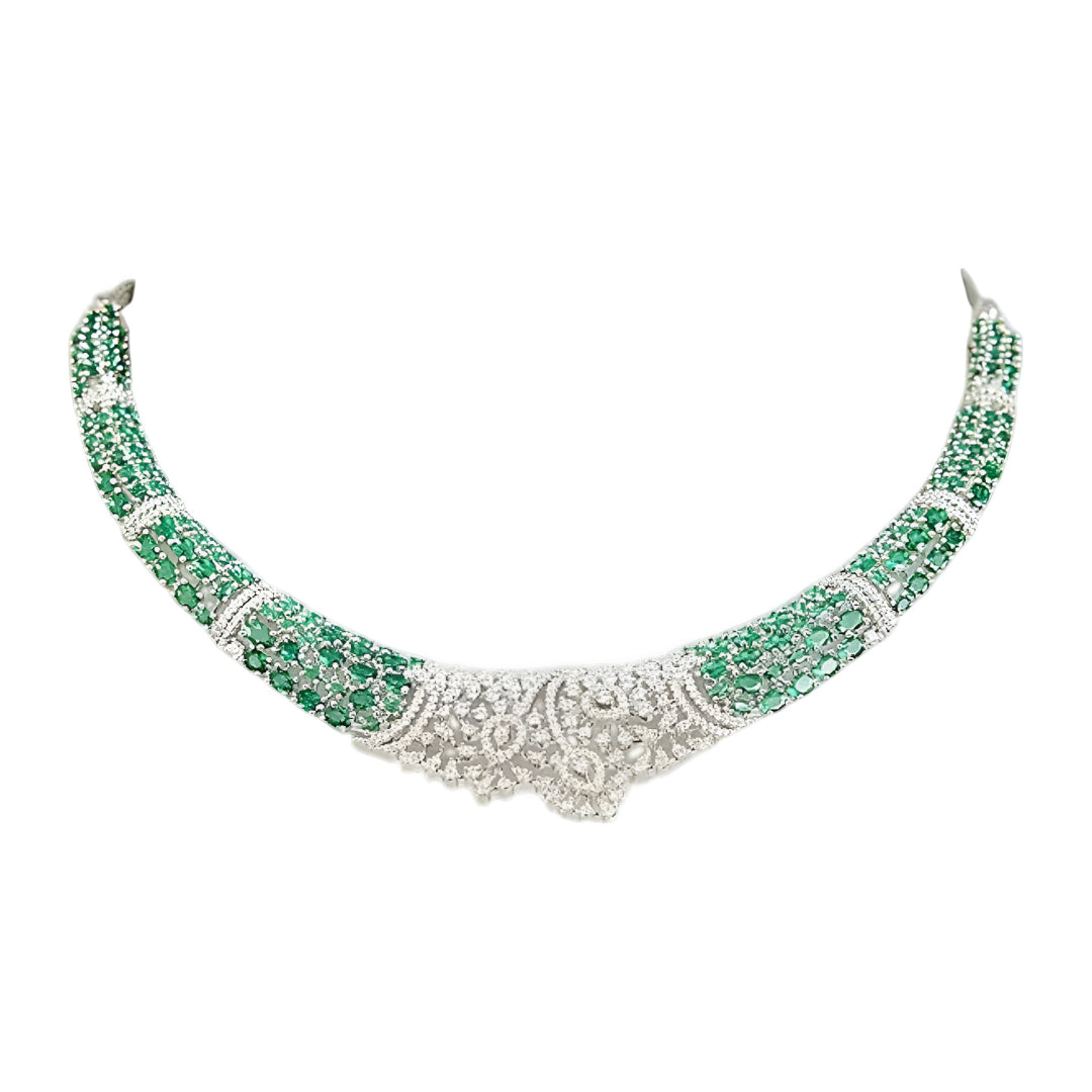 Silver-toned emerald green crystal choker necklace set featuring sparkling stone detailing and matching statement drop earrings on a white background.