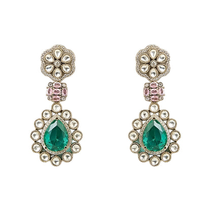 Traditional emerald green kundan choker necklace set with floral motifs and matching drop earrings for bridal and festive wear.