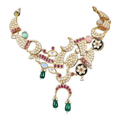 Designer gold-plated kundan necklace set with floral enamel motifs, pink stone accents, sparkling white kundan work, green bead drops, and matching statement earrings.