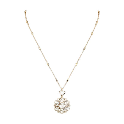 Gold-tone floral crystal pendant necklace with matching crystal earrings jewelry set featuring sparkling clear stones and elegant flower design.