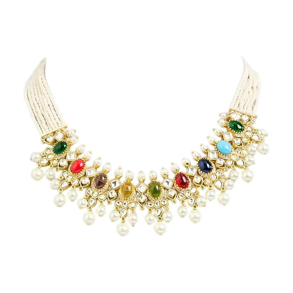Gold-toned Navratna Kundan choker necklace set with multicolored stones, pearl drops, and matching green stone jhumka earrings on a white background.