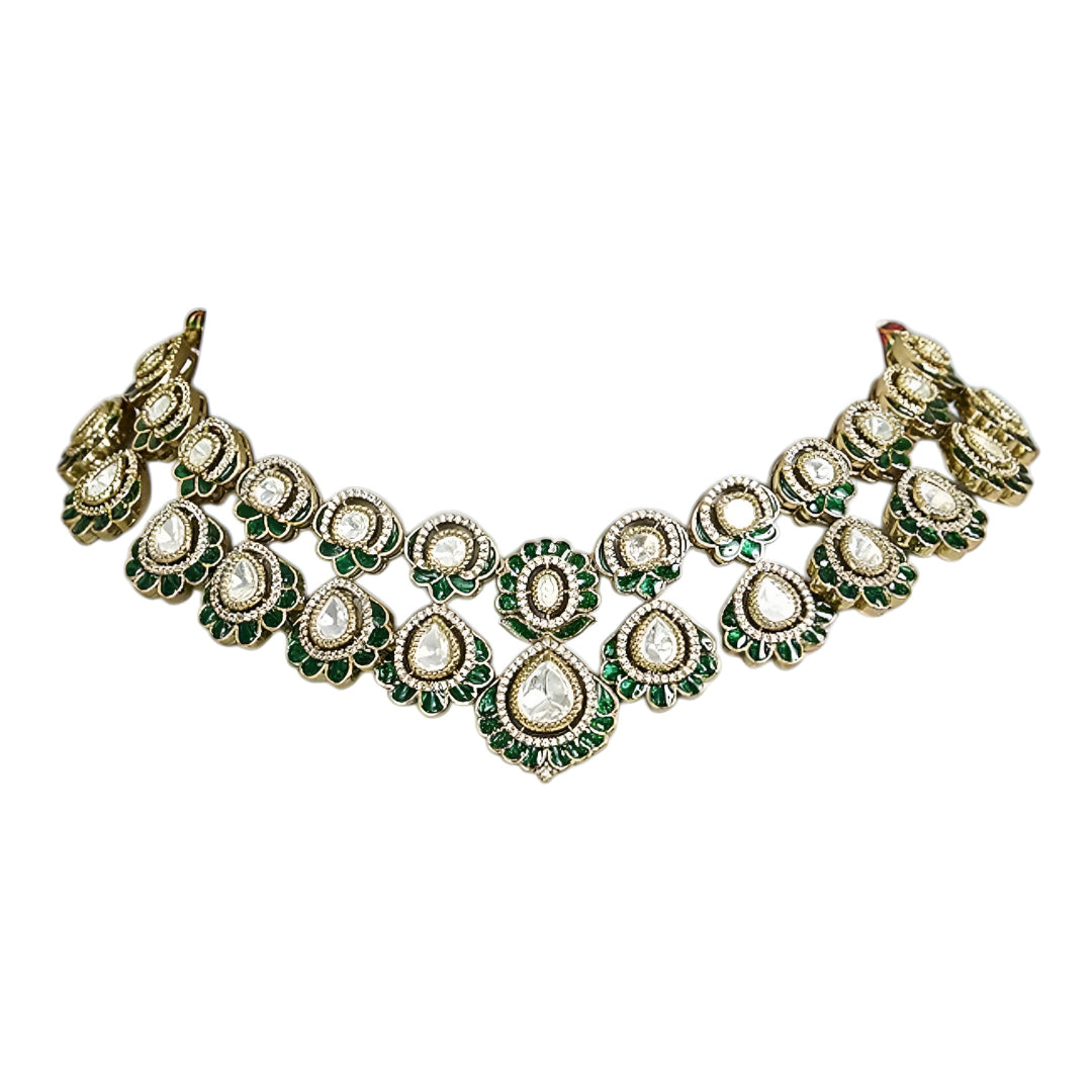 Green Kundan Polki bridal necklace set with matching earrings featuring white stones and emerald green accents in antique gold finish.