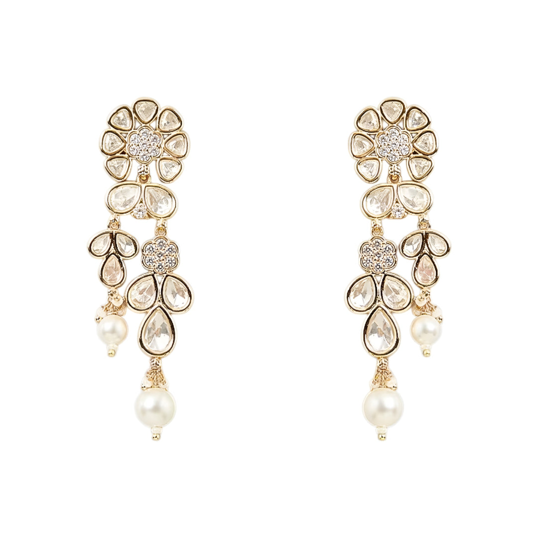 Gold-toned Kundan pearl choker necklace set featuring floral motifs, teardrop stones, pearl danglers, and matching earrings on a white background.