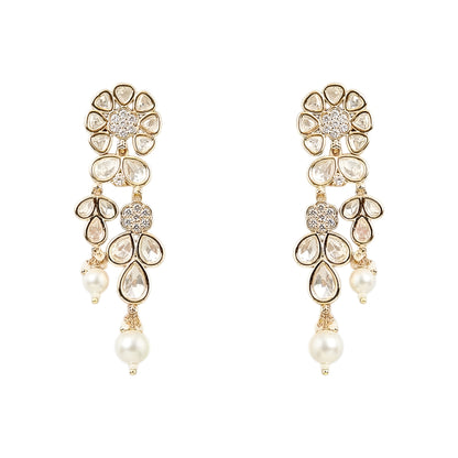 Gold-toned Kundan pearl choker necklace set featuring floral motifs, teardrop stones, pearl danglers, and matching earrings on a white background.