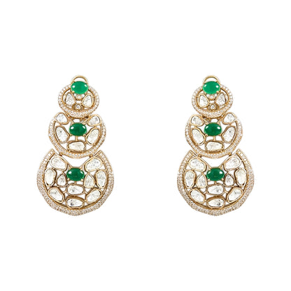 Luxury Kundan Polki necklace set with matching earrings featuring uncut Polki diamonds, green emerald accents, and traditional bridal jewelry craftsmanship in a gold finish.