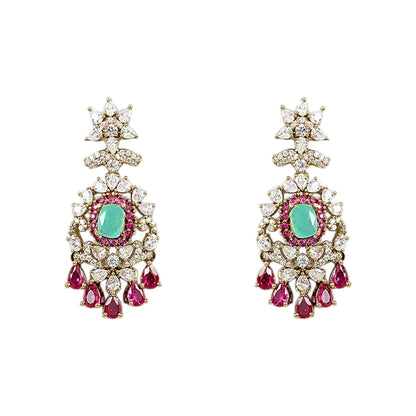 Luxury emerald green kundan choker necklace set with sparkling polki stones, ruby pink accents, and matching chandelier earrings for bridal and wedding wear.