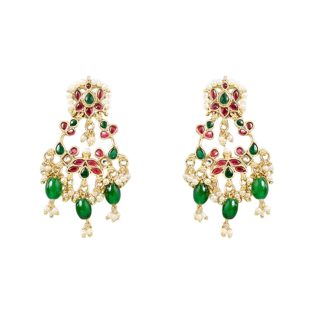 Traditional gold-plated Kundan choker necklace set with red and green stones, dangling green beads, and matching chandbali earrings for bridal wear.