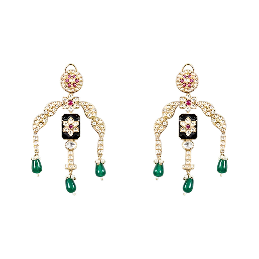 Designer gold-plated kundan necklace set with floral enamel motifs, pink stone accents, sparkling white kundan work, green bead drops, and matching statement earrings.