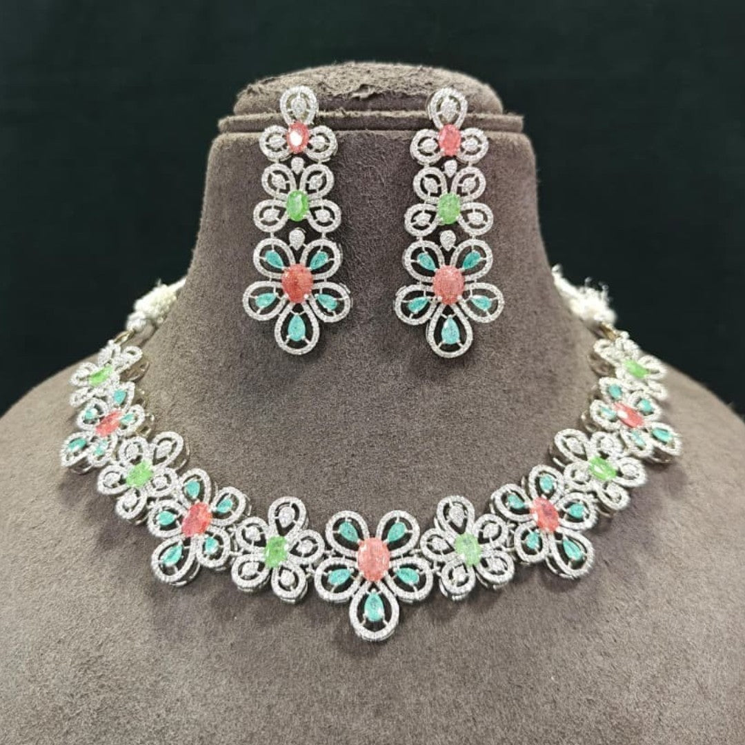 Silver-tone American diamond floral choker necklace set with coral-pink, light-green and mint stones and matching long drop earrings