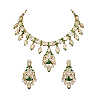 Gold-tone green meenakari kundan necklace set with round centre pendant, leaf-shaped drops and matching drop earrings on a grey display bust