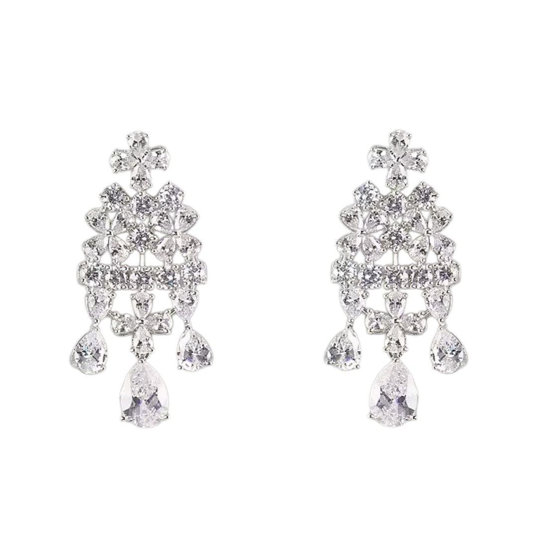 "Silver-plated floral chandelier earrings with cubic zirconia stones and pear-shaped crystal drops, product shot on grey background"