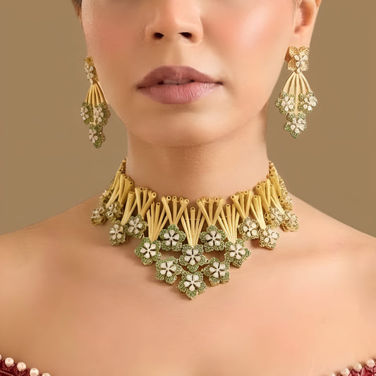 Matte gold choker necklace with green zircon flowers and textured bamboo style stems