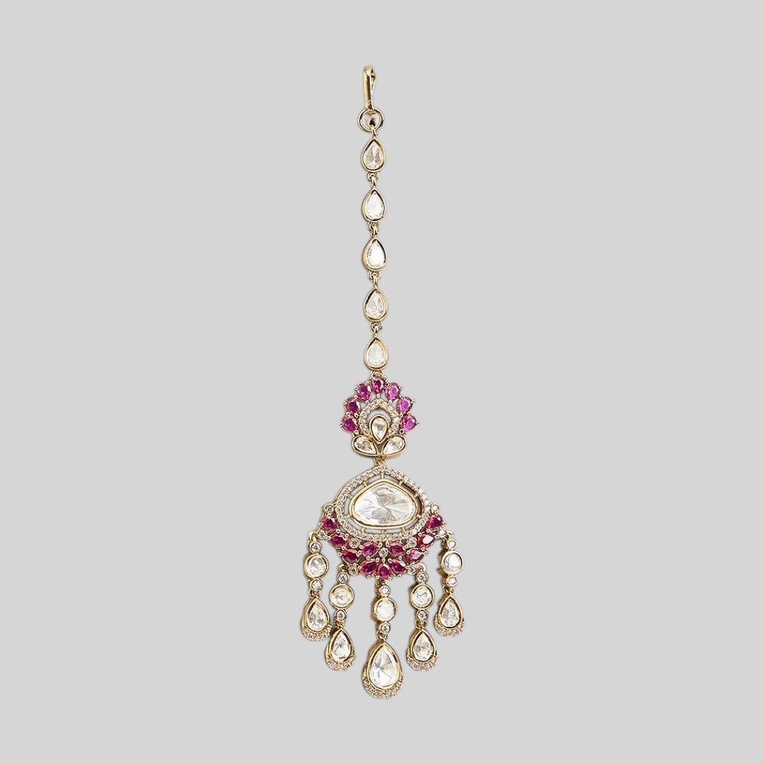 Gold finish kundan polki maang tikka with ruby pink pear-stone fan, large clear centre stone, American diamond halo and chandelier-style kundan drops – Auraa Trends