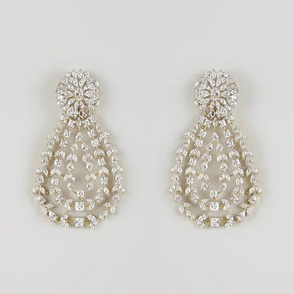 Gold-toned white stone chandelier earrings with floral top and teardrop design"