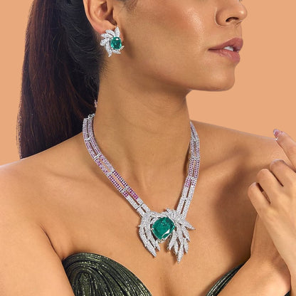 Emerald and diamond leaf design necklace and earrings set with ruby-pink accents on silver base – luxury women’s jewelry set
