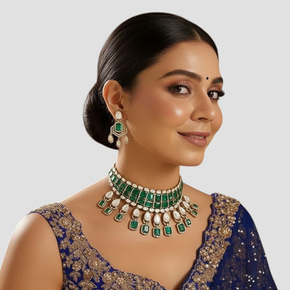 “Traditional choker necklace set featuring emerald-green square stones, Polki-style pear-shaped drops, and matching dangling earrings displayed on a neutral background.”