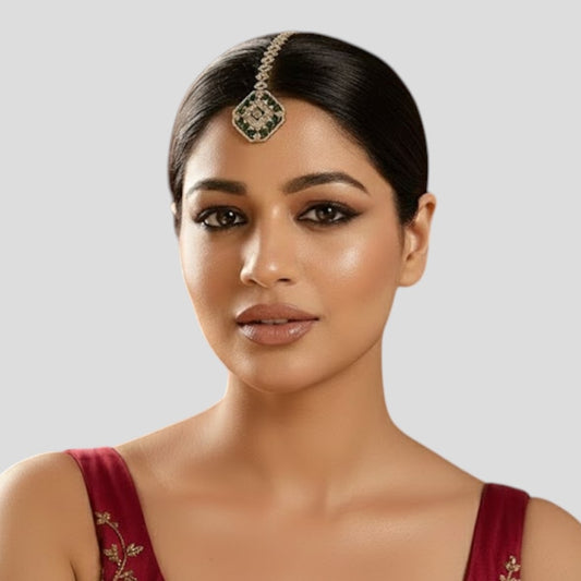 Gold-plated green Kundan maang tikka with diamond-shaped stone chain and octagon pendant