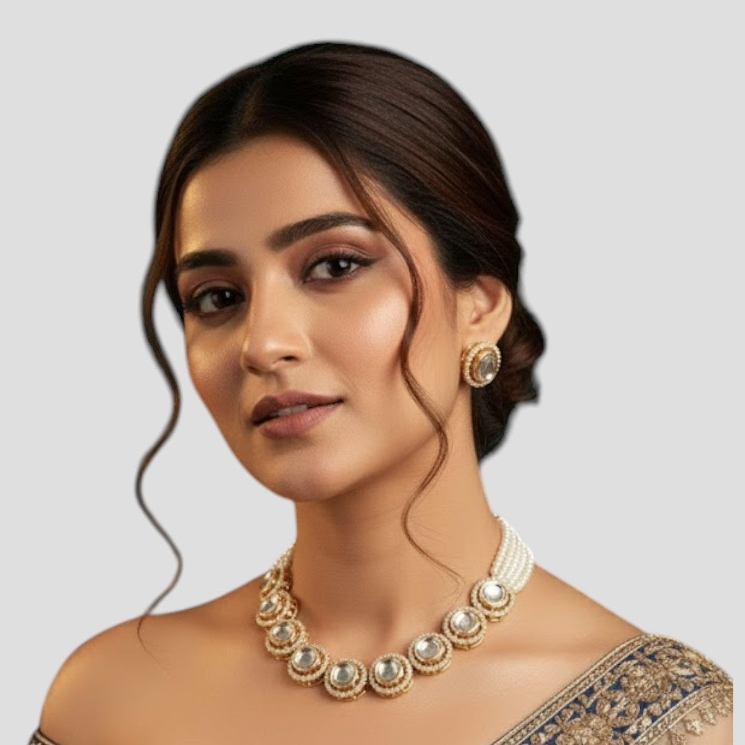 “Gold-plated Kundan choker necklace set with pearl strands and matching stud earrings.”