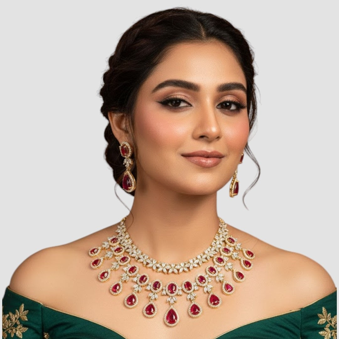“Gold-plated necklace set with red ruby teardrop stones and matching earrings for women.”