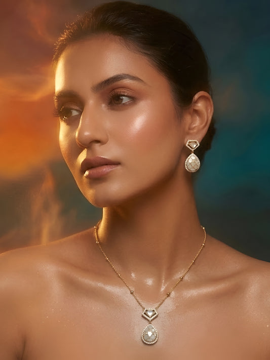 Gold-plated pearl teardrop pendant necklace set with matching stud earrings embellished with American diamonds for women.