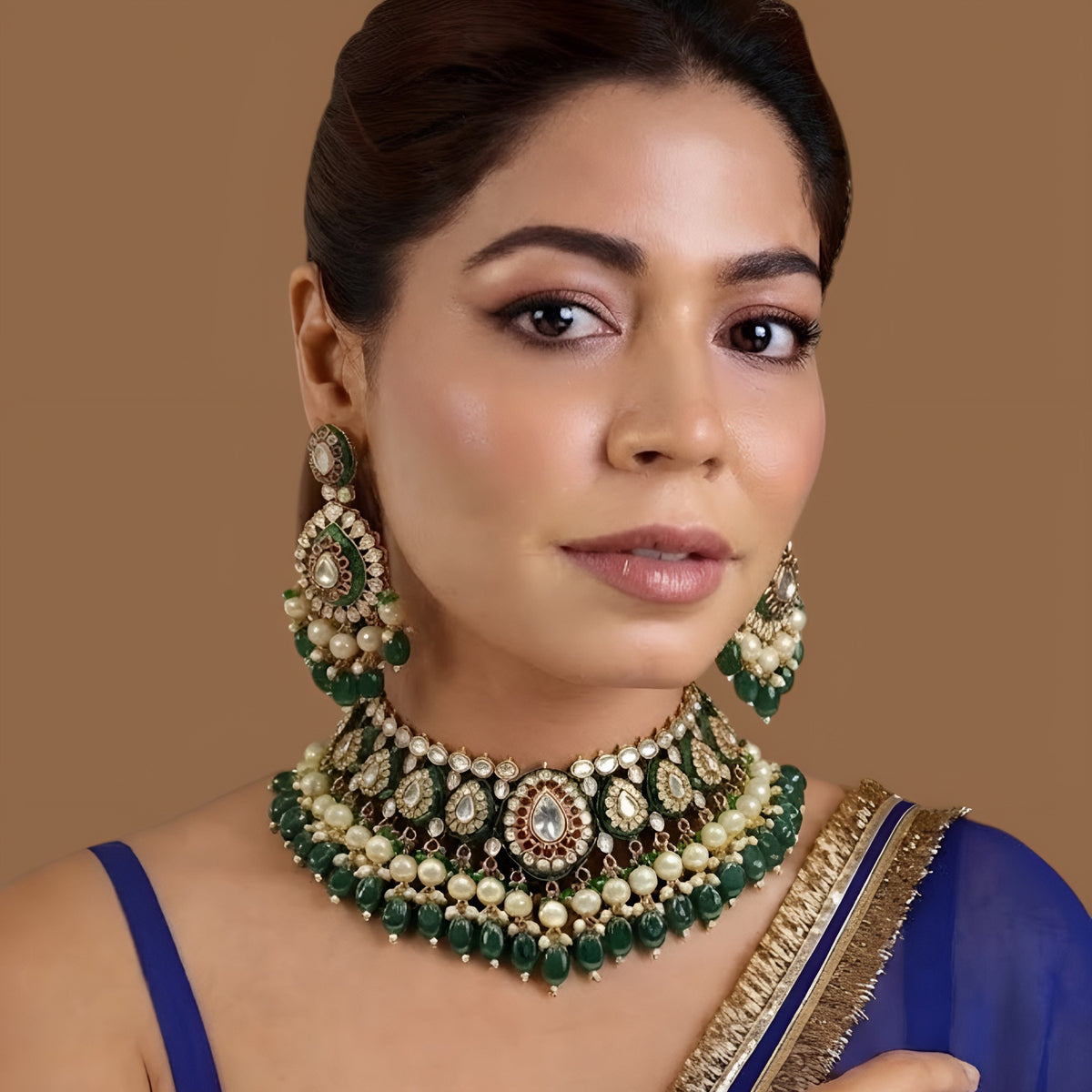 Gold-finish green meenakari kundan polki bridal choker necklace set with pearl and emerald bead drops and matching chandelier earrings