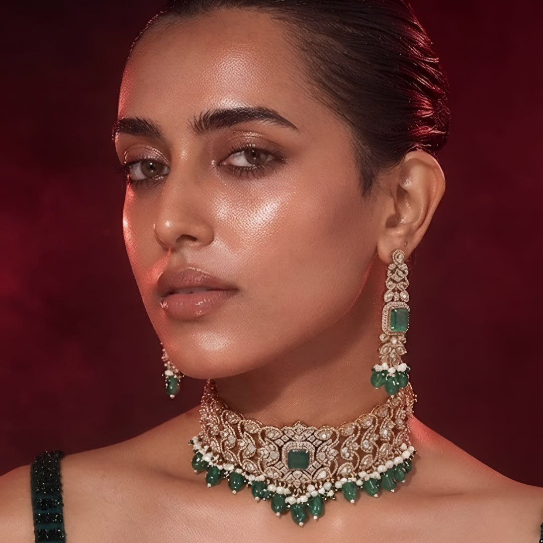 "Antique gold wide Kundan choker necklace with emerald and pearl bead drops, matching long drop earrings"