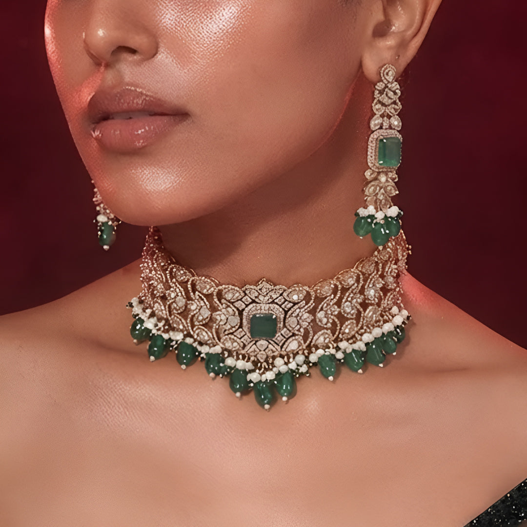"Antique gold wide Kundan choker necklace with emerald and pearl bead drops, matching long drop earrings"