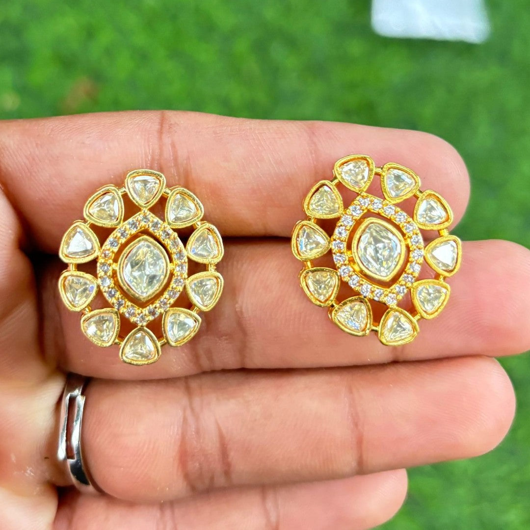 Pair of gold finish kundan polki stud earrings with clear centre stone and zircon halo