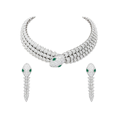 Rhodium-plated snake-inspired necklace set with green and white stones and matching earrings