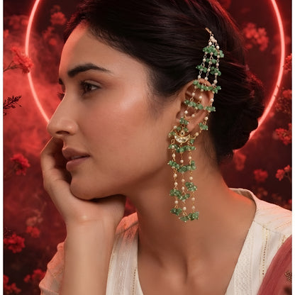 "Gold ear cuff earring with cascading green onyx beads and pearls, worn by model with dark hair in updo"